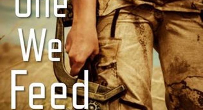 Part of the cover of The one we feed by Kameron Hurley. a soldier's hand carrying a futuristic looking rifle by their waist