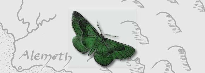 Green moth sitting on top of a map